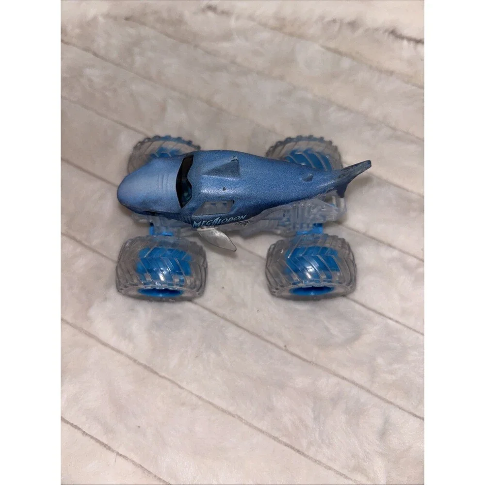 Monster Jam Megalodon Shark Monster Truck 1:64 Scale Clear Ice Tires Translucent